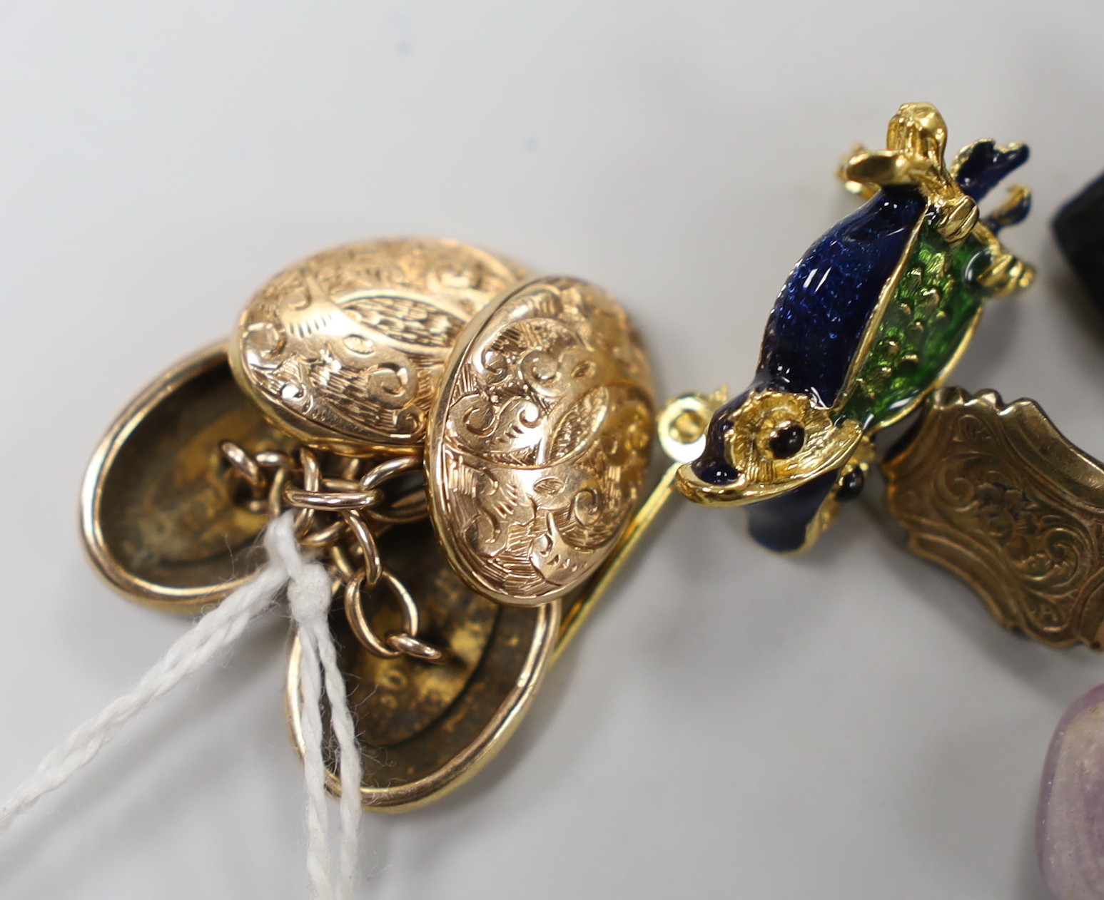 A pair of engraved 10ct oval cufflinks, 3.8 grams, two yellow metal and diamond chip set 'silhouette' charms and a quantity of sundry jewellery etc. including a lady's 9ct Buren wrist watch, Royal Scottish Automobile Clu